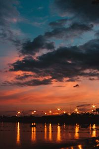 Preview wallpaper sunset, sea, lights, skyline, clouds, philippines