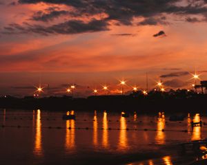 Preview wallpaper sunset, sea, lights, skyline, clouds, philippines