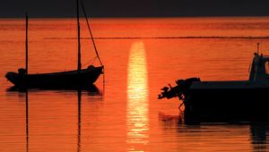 Preview wallpaper sunset, sea, mountains, boats, reflection, dark