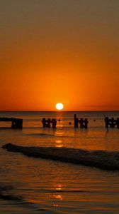 Preview wallpaper sunset, sea, pier, pilings