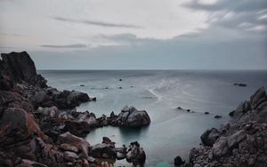 Preview wallpaper sunset, sea, rocks, sky