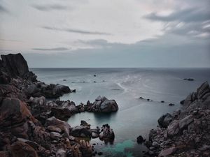 Preview wallpaper sunset, sea, rocks, sky