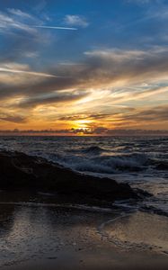 Preview wallpaper sunset, sea, rocks, coast, surf