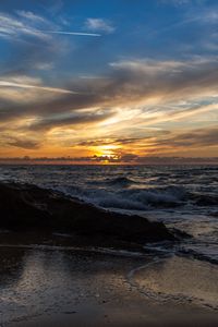 Preview wallpaper sunset, sea, rocks, coast, surf