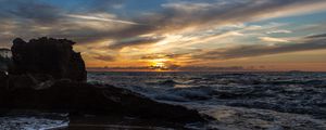 Preview wallpaper sunset, sea, rocks, coast, surf