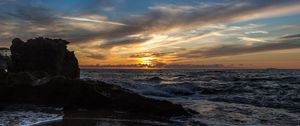 Preview wallpaper sunset, sea, rocks, coast, surf