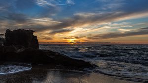 Preview wallpaper sunset, sea, rocks, coast, surf