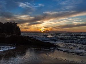 Preview wallpaper sunset, sea, rocks, coast, surf