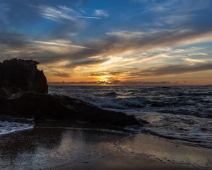 Preview wallpaper sunset, sea, rocks, coast, surf