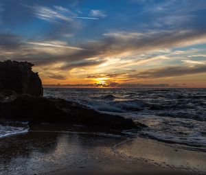 Preview wallpaper sunset, sea, rocks, coast, surf