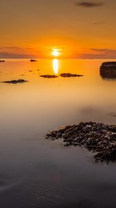 Preview wallpaper sunset, sea, rocks, horizon