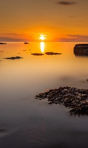 Preview wallpaper sunset, sea, rocks, horizon