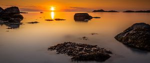 Preview wallpaper sunset, sea, rocks, horizon