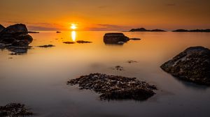 Preview wallpaper sunset, sea, rocks, horizon