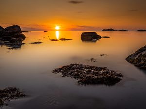 Preview wallpaper sunset, sea, rocks, horizon