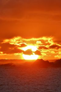 Preview wallpaper sunset, sea, rocks, sun, dusk