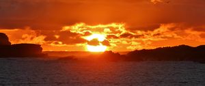 Preview wallpaper sunset, sea, rocks, sun, dusk