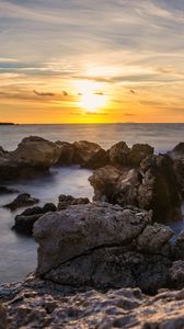 Preview wallpaper sunset, sea, rocks, water, landscape