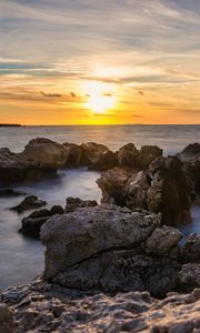 Preview wallpaper sunset, sea, rocks, water, landscape