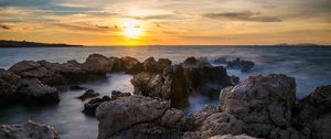 Preview wallpaper sunset, sea, rocks, water, landscape