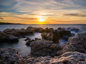 Preview wallpaper sunset, sea, rocks, water, landscape