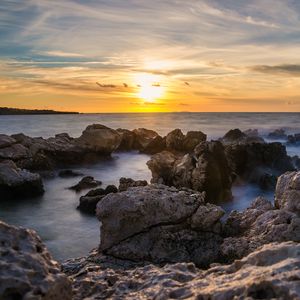 Preview wallpaper sunset, sea, rocks, water, landscape