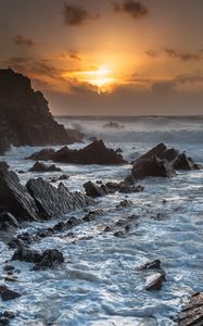 Preview wallpaper sunset, sea, rocks, waves, landscape