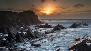 Preview wallpaper sunset, sea, rocks, waves, landscape