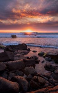 Preview wallpaper sunset, sea, shore, stones, landscape