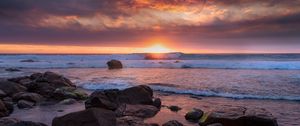 Preview wallpaper sunset, sea, shore, stones, landscape