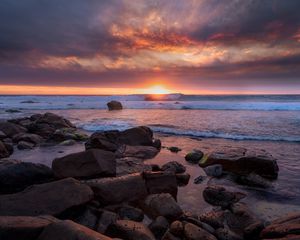 Preview wallpaper sunset, sea, shore, stones, landscape