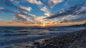 Preview wallpaper sunset, sea, sky, pier, stones