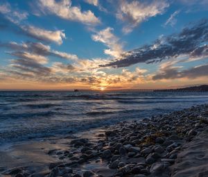 Preview wallpaper sunset, sea, sky, pier, stones