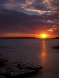 Preview wallpaper sunset, sea, stones, horizon