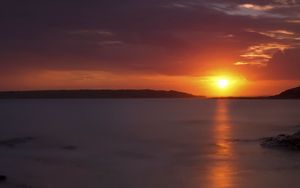Preview wallpaper sunset, sea, stones, horizon