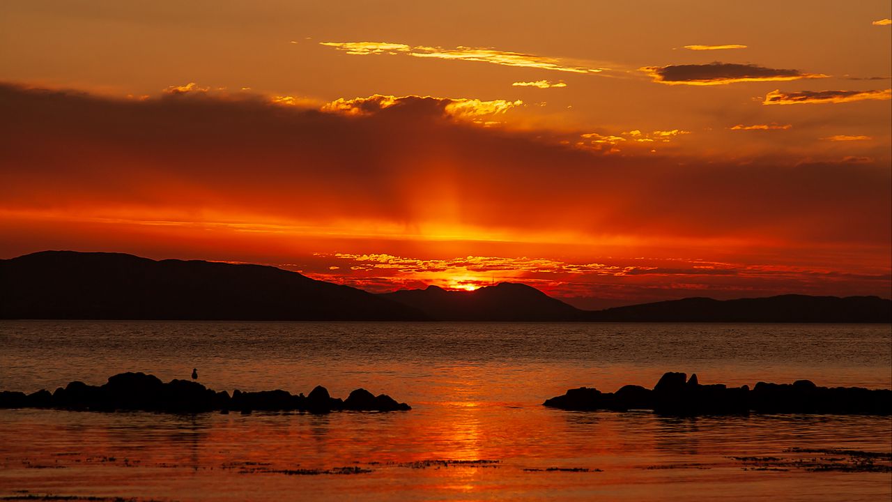 Wallpaper sunset, sea, stones, hills, sky