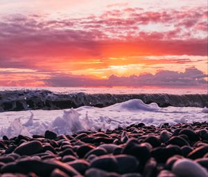 Preview wallpaper sunset, sea, waves, shore, pebbles