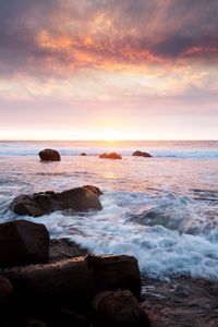 Preview wallpaper sunset, sea, waves, stones, landscape