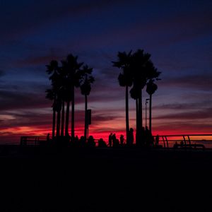 Preview wallpaper sunset, silhouettes, palm trees, people, tropics, sky