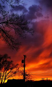 Preview wallpaper sunset, sky, clouds, silhouette, trees, wires, evening