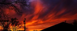 Preview wallpaper sunset, sky, clouds, silhouette, trees, wires, evening