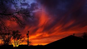 Preview wallpaper sunset, sky, clouds, silhouette, trees, wires, evening