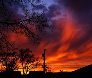 Preview wallpaper sunset, sky, clouds, silhouette, trees, wires, evening