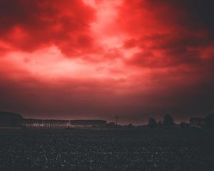 Preview wallpaper sunset, sky, horizon, field, clouds, red