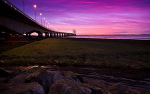 Preview wallpaper sunset, sky, river, bridge, lights, road