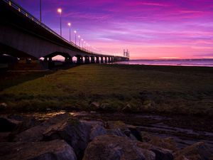 Preview wallpaper sunset, sky, river, bridge, lights, road