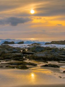 Preview wallpaper sunset, sky, stones, coast, sand