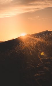 Preview wallpaper sunset, slope, sun, hill, rays