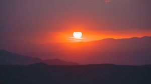 Preview wallpaper sunset, slope, sun, hills, sky