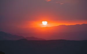 Preview wallpaper sunset, slope, sun, hills, sky